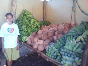 With a hopeful start, Loida stands beside the kalakals of her buy and sell business. 