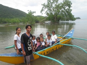 Mark Bering together with his family and other Pantawid Pamilya children-beneficiaries in their barangay pose while embarking not just on their school destination but also for their better future. 