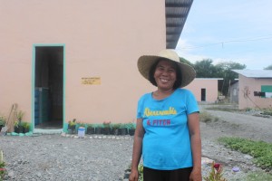 Lina Basit shows her glee as she pose in front of her new and own home. 