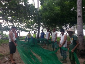 Members of the association prepare the fish net for the construction of fishcage